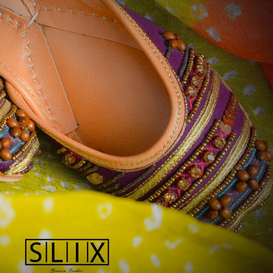 A Breathtaking Pair of Khussa with beads and Stone on a magenta base (Pure Leather)