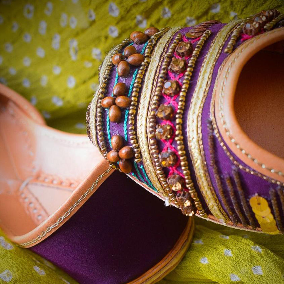 A Breathtaking Pair of Khussa with beads and Stone on a magenta base (Pure Leather)